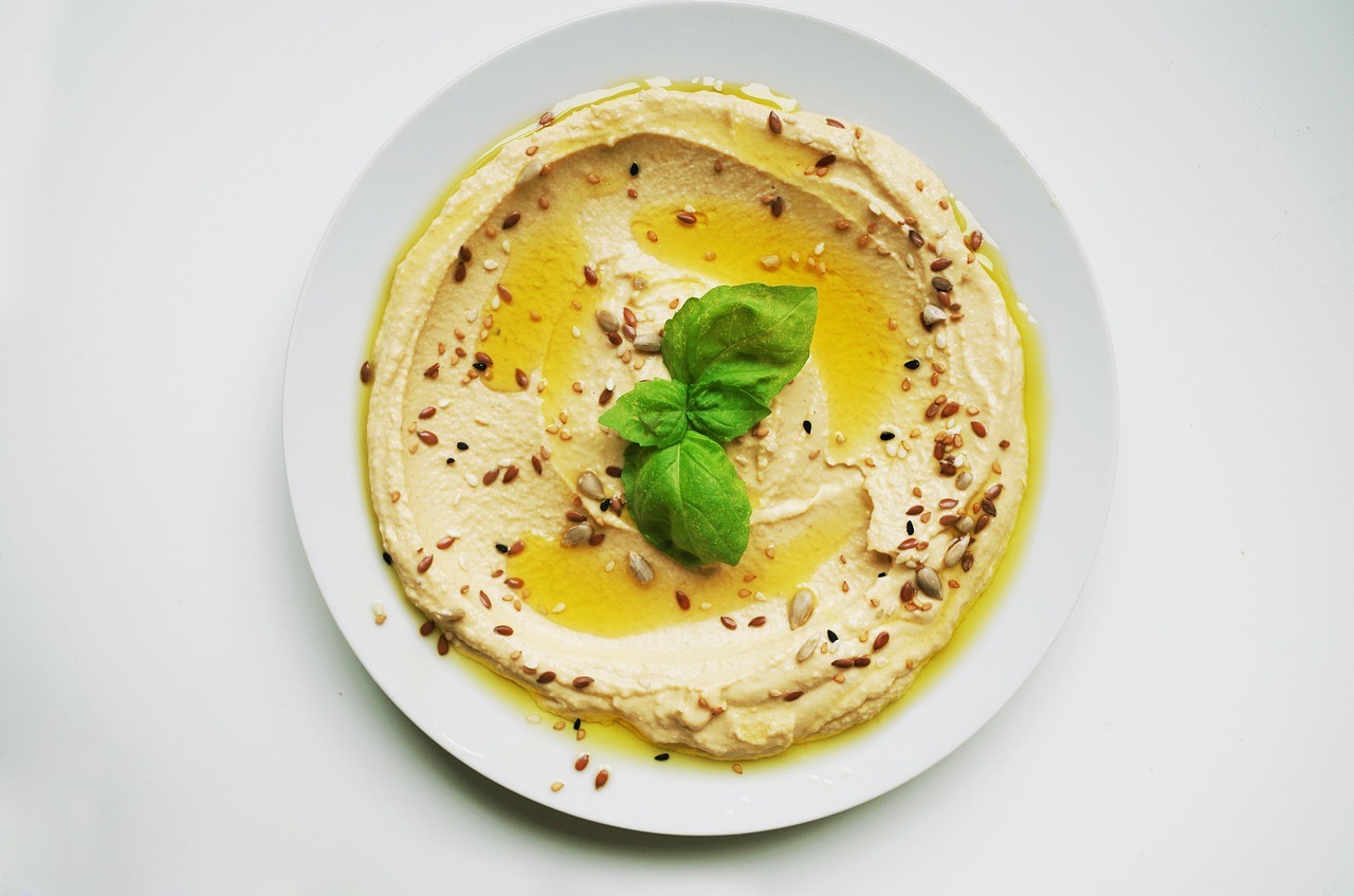 A serving of hummus in a plate