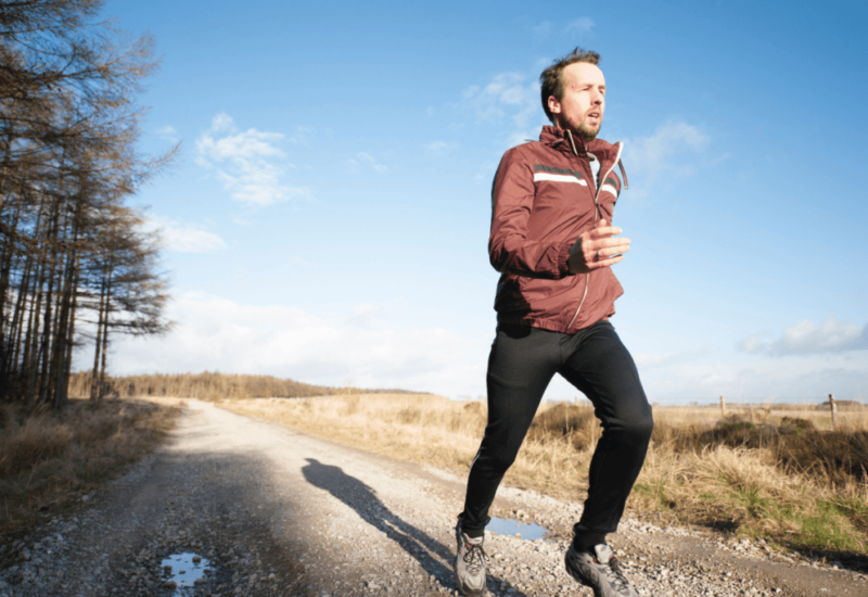 A man running during daytime enjoying the health benefits of probiotics