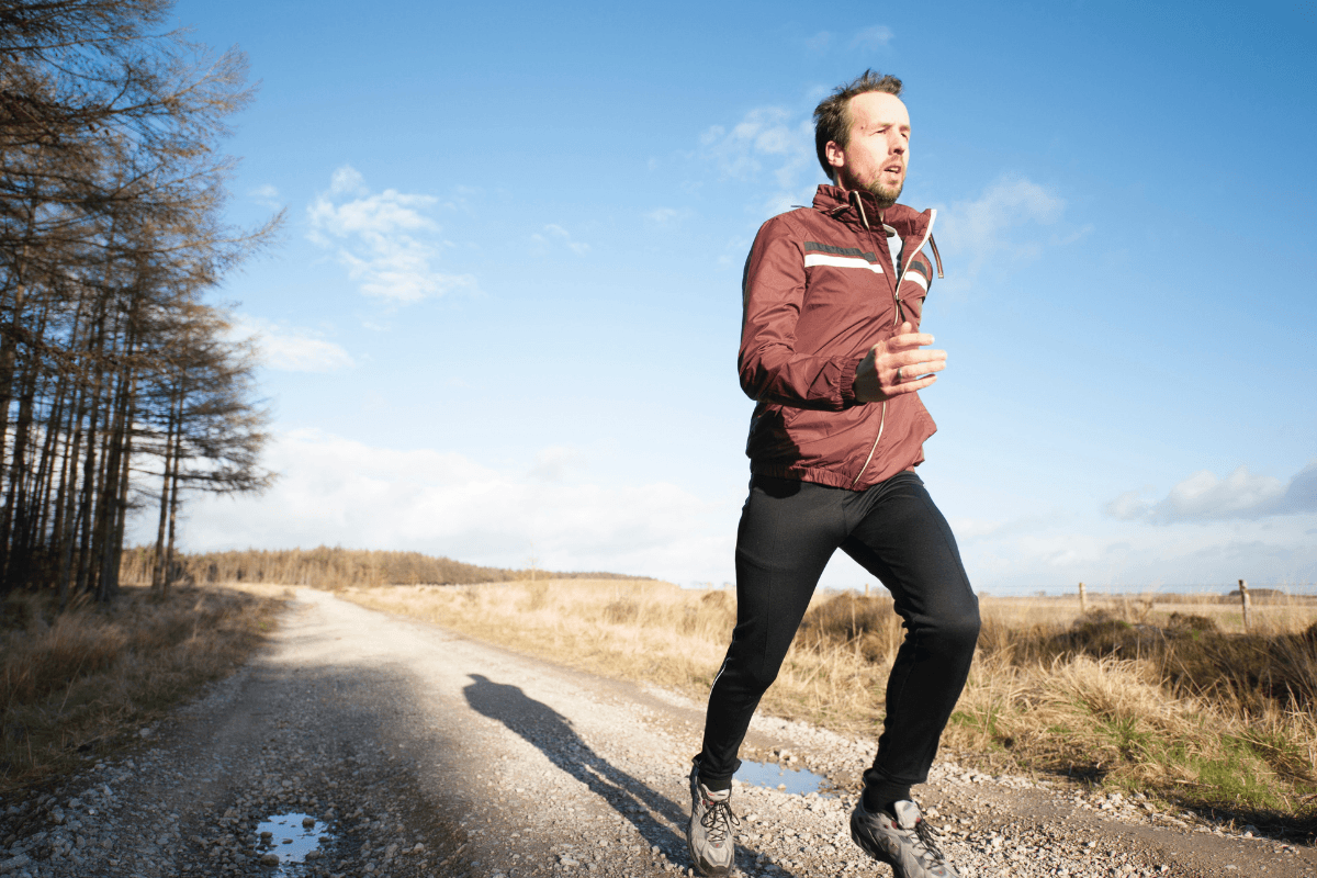 A man running during daytime enjoying the health benefits of probiotics