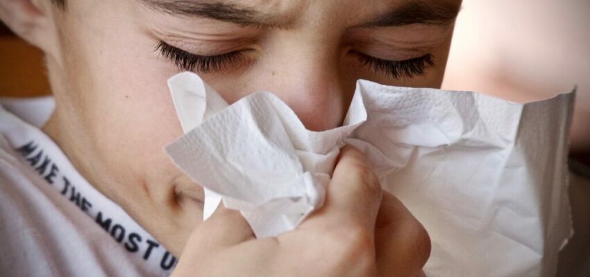 A child having colds and sneezing