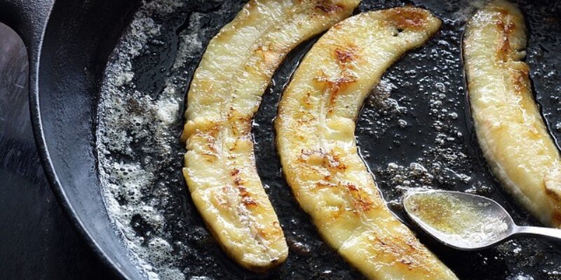 Caramelized slices of banana in a cooking pan