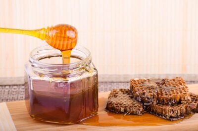Organic locally-sourced raw honey in a glass jar