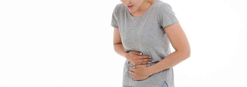 A woman experiencing intestinal spasms.