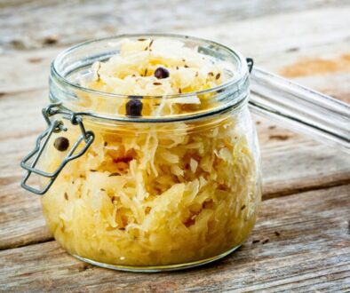 Mason jar filled with sauerkraut showcasing health benefits sauerkraut gives for gut health