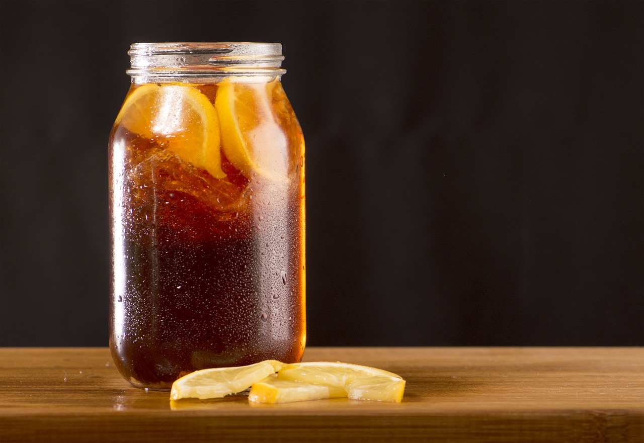 An ice-cold kombucha in a glass jar.