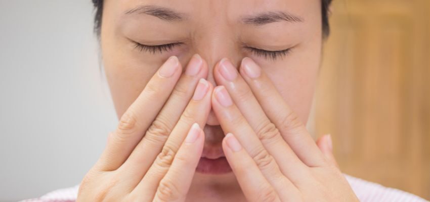 The woman was annoyed by the crackling sounds in her sinuses.