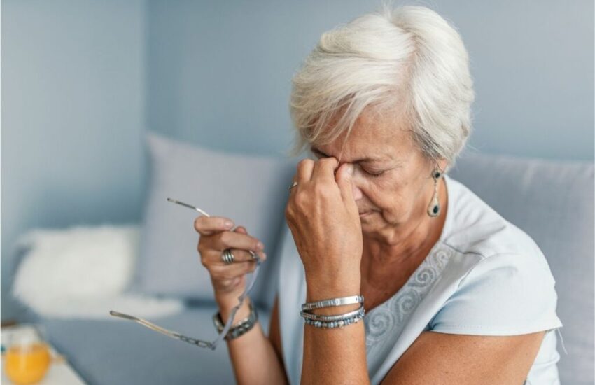 A woman smiling after her mouth sore was treated.