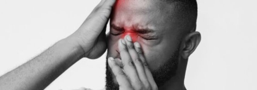 A picture of a man trying to treat his sinus infection that won't go away