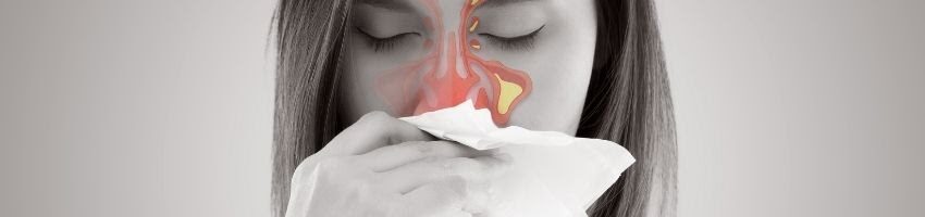 A woman trying to use pressure point treatment for her sinus infection.