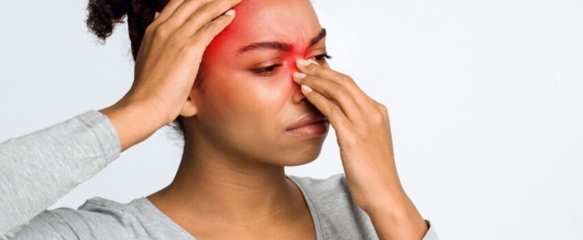 A woman smiling after her mouth sore was treated.