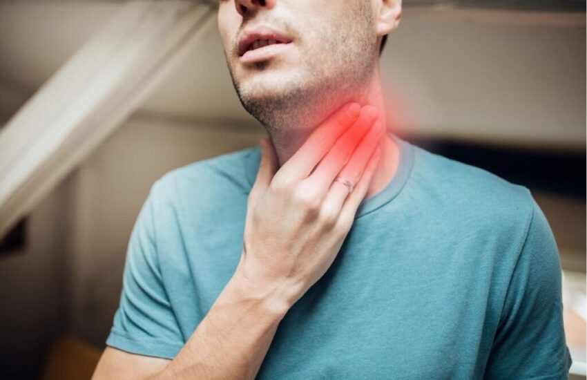 A woman smiling after her mouth sore was treated.