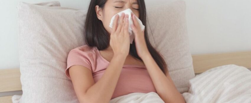 A woman smiling after her mouth sore was treated.