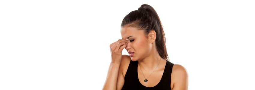 A woman experiencing aerosinusitis.