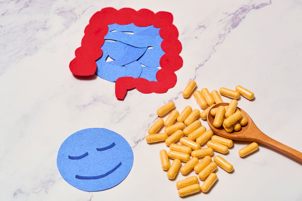The spoon of probiotics supplements spilled onto the table.