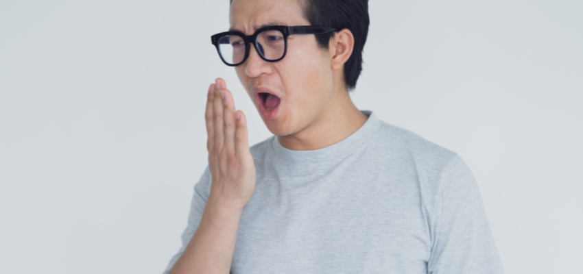 A woman eating sweet foods to get rid of salty taste in mouth.