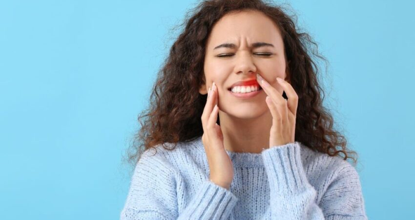 A woman with a bad tooth causes sinus problems.