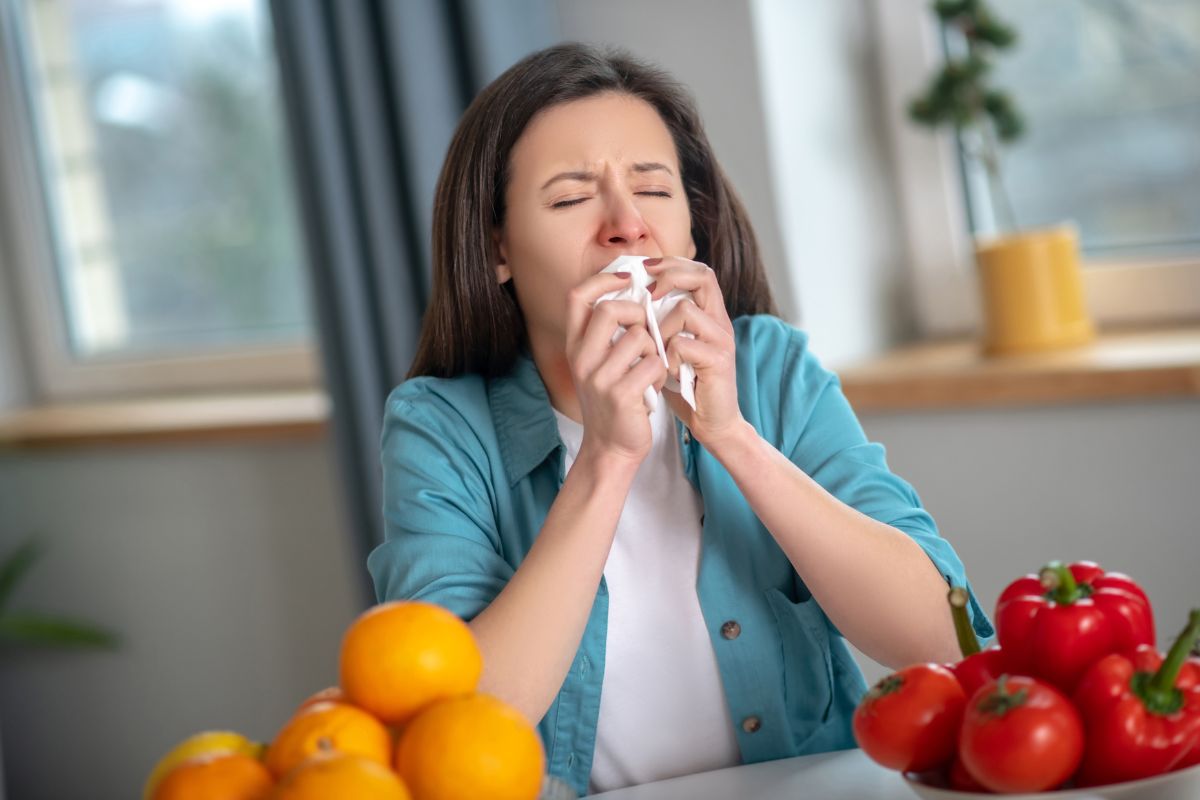 The woman with a runny nose while eating.