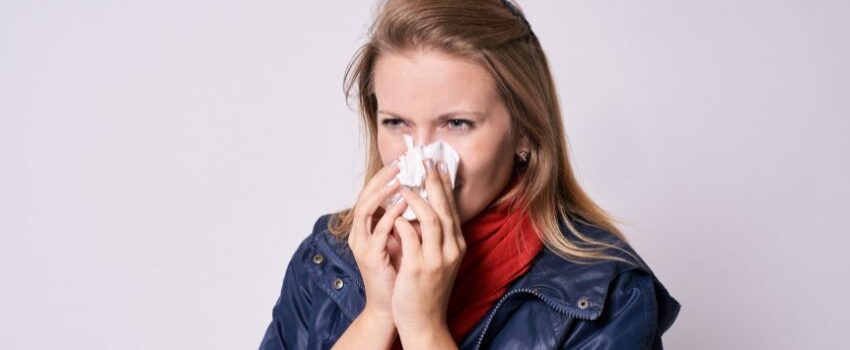 A woman eating sweet foods to get rid of salty taste in mouth.