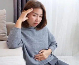 The woman has sinus and stomach problems.