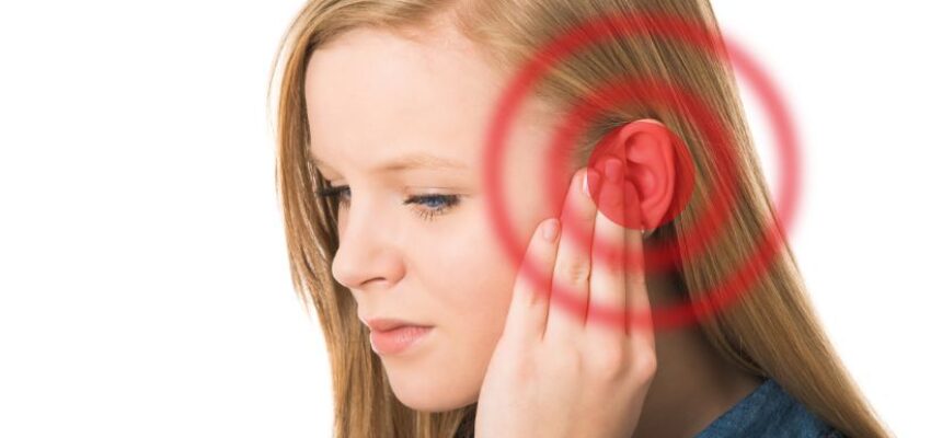 A woman experiences temporary tinnitus during a sinus infection due to changes in pressure, fluid buildup, or inflammation.