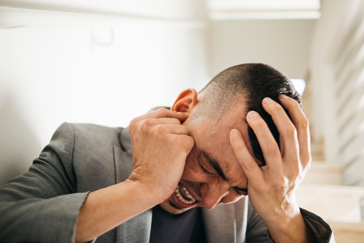 A man suffers from earache and headache at the same time.