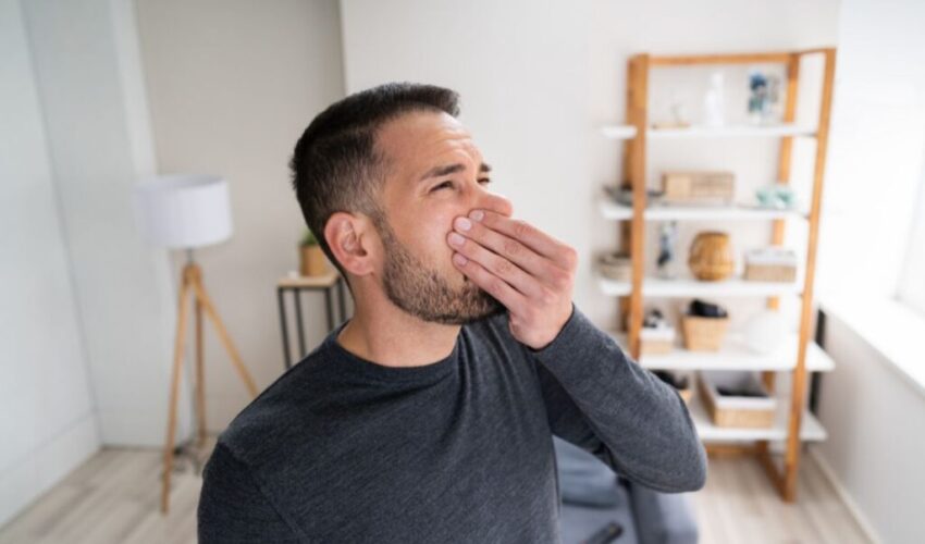 The man notice his bad smell in nose.