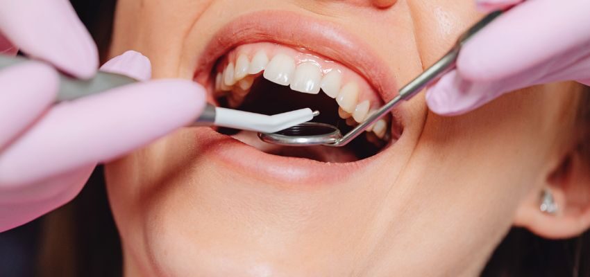 The woman has a dental check-up.