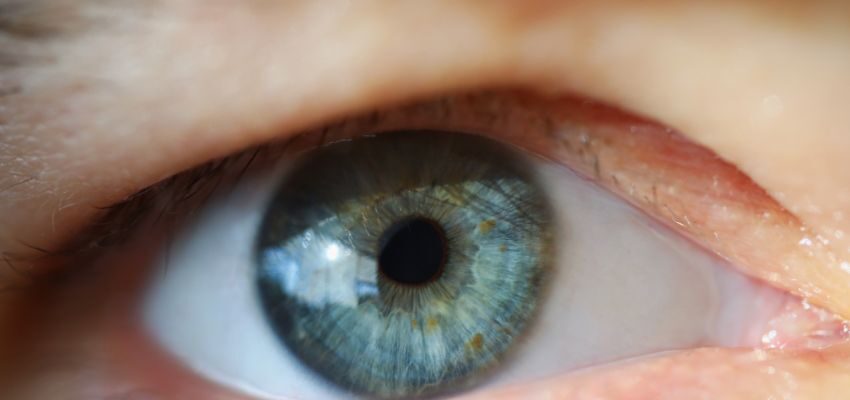 The person experiences symptoms like a sunken eye, drooping eyelid, or displaced eyeball.