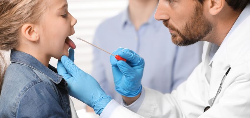 When diagnosing a patient, the doctor conducts tests like a rapid test or a throat culture. In either case, the doctor will swab the throat with a cotton-tipped swab.