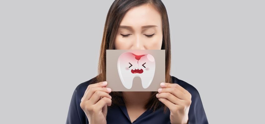 Tooth decay occurs due to damage caused by acid-producing bacteria that interact with the tooth's enamel.