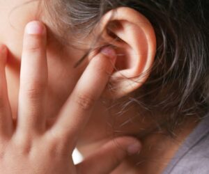 The child feels pain because of an ear infection.