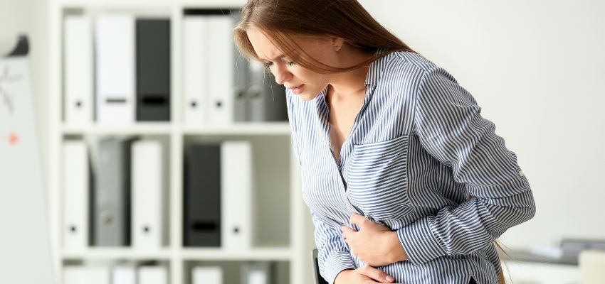 The woman feels symptoms of Diverticulitis.