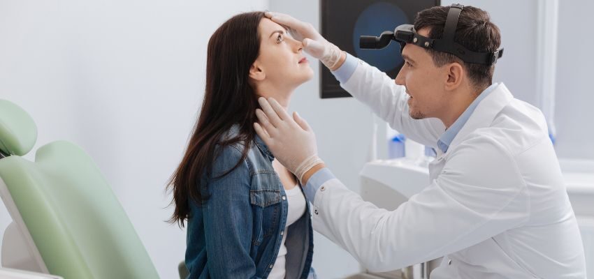 The woman seeks help from a doctor to treat her dry nose.