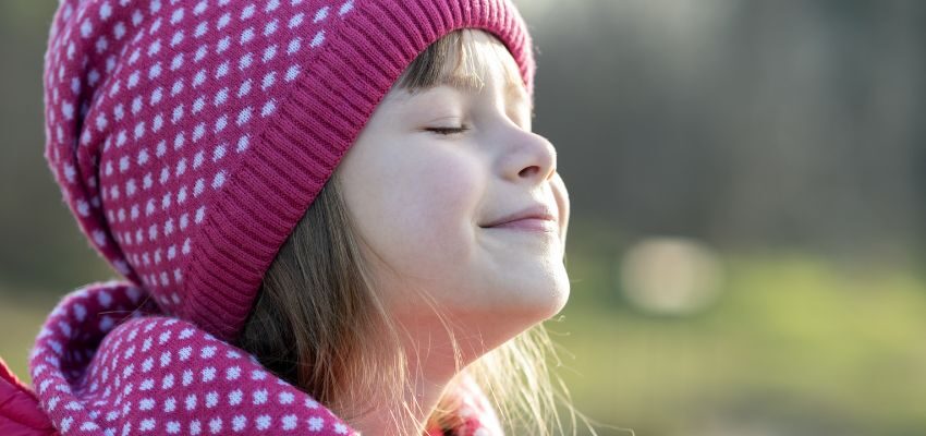 The kid feels happy after healing from post-nasal drip.