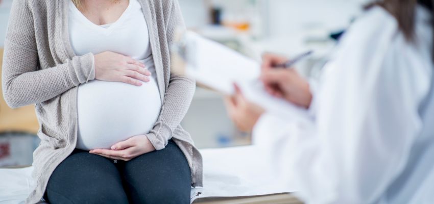 The pregnant woman consults a doctor to find out if it is safe to take probiotics while pregnant.