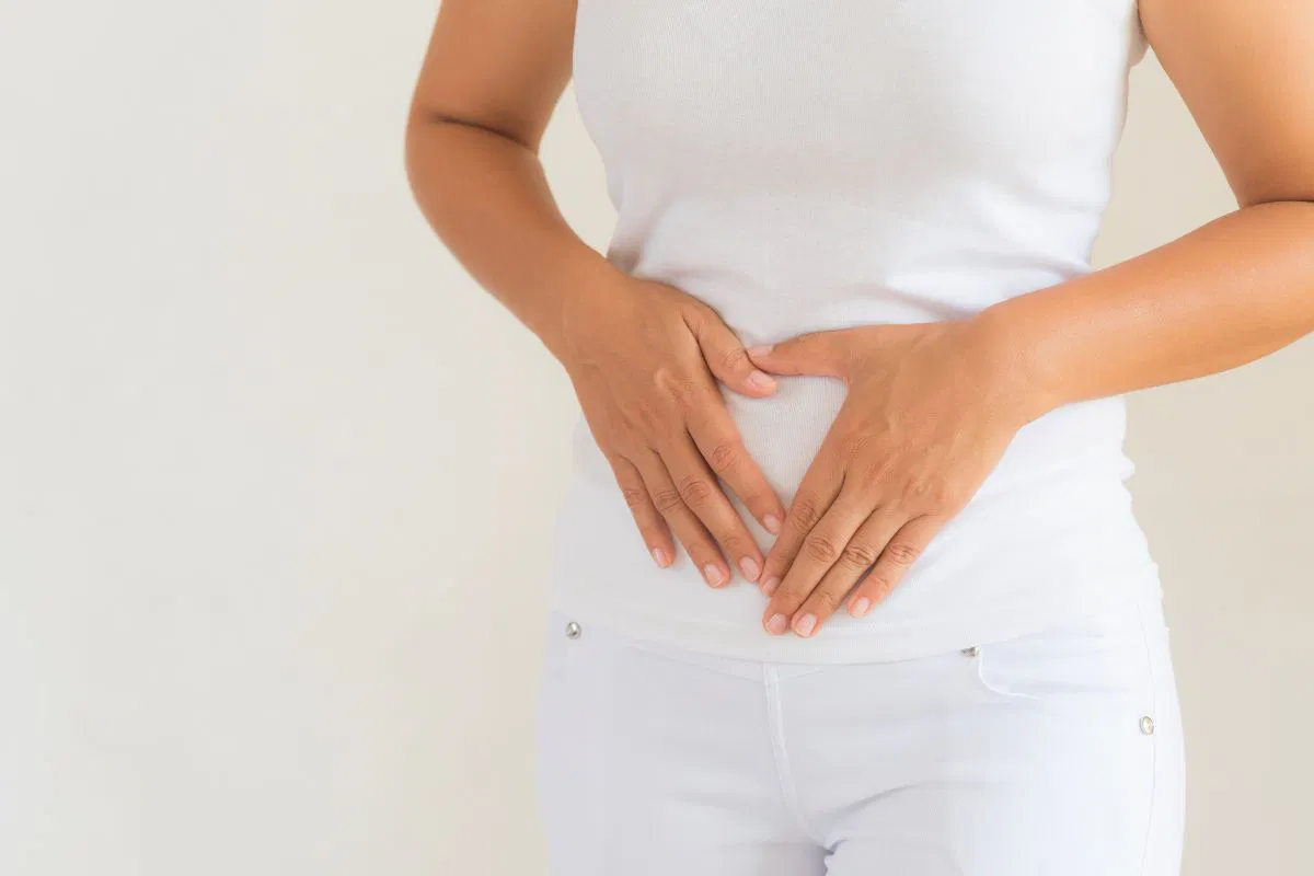 The woman has a healthy digestive system due to the presence of probiotics.