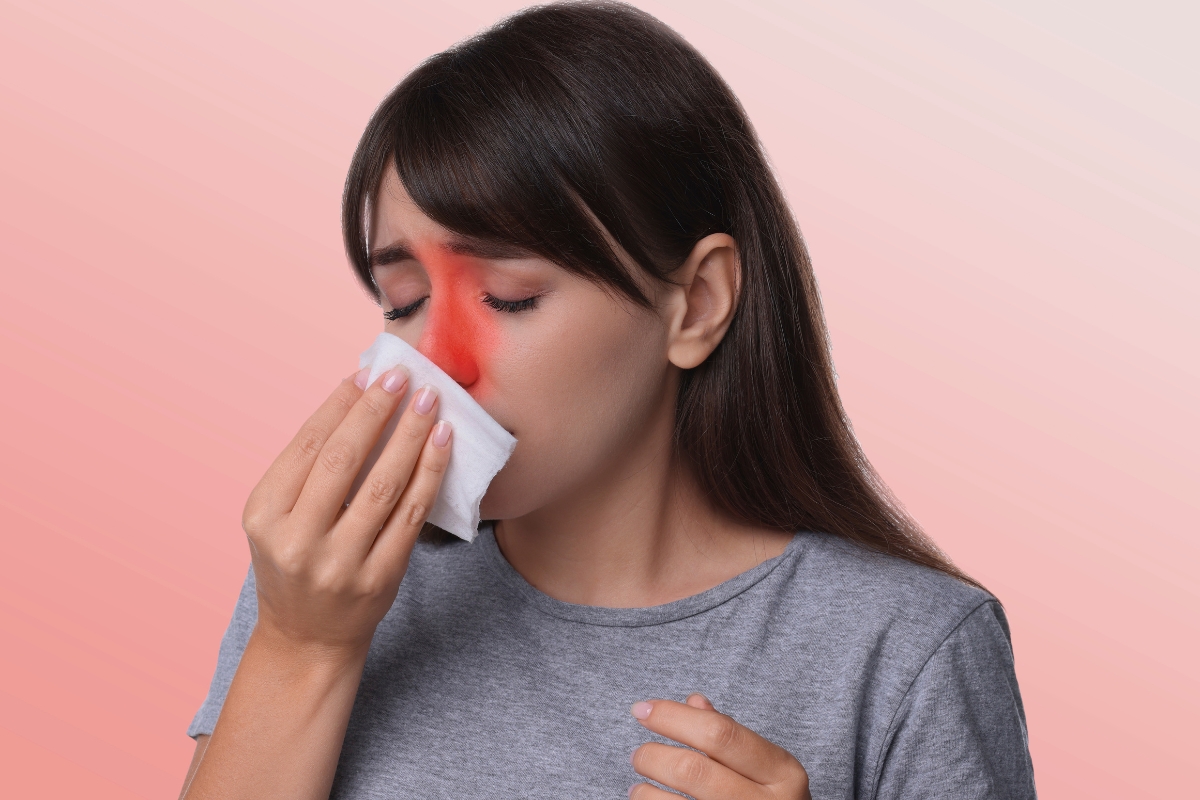 Woman with a red nose using a tissue, showing symptoms often treated with prednisone for sinus infection.