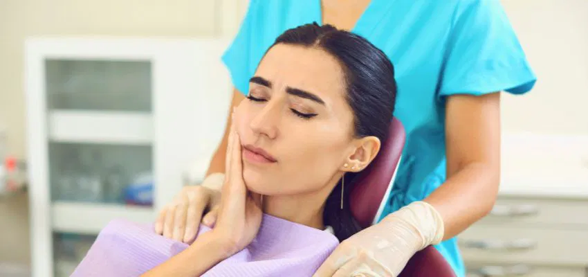 The woman consults an expert due to mouth ulcers.