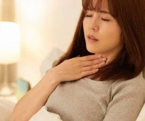 The woman's throat hurt when she woke up.