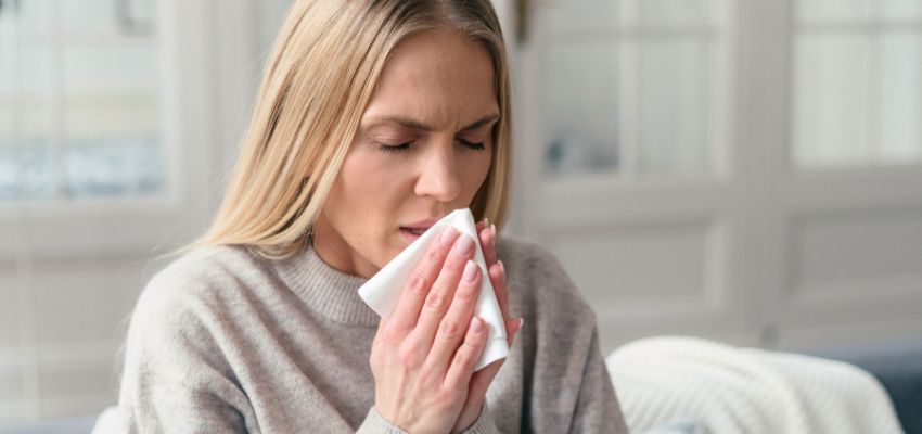 The woman has symptoms of an upper respiratory tract infection.