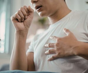 The man has symptoms of an upper respiratory tract infection.