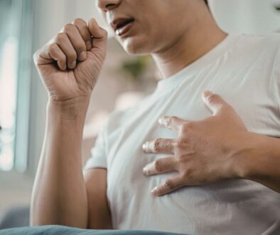 The man has symptoms of an upper respiratory tract infection.