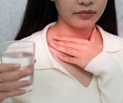 The woman is experiencing symptoms of Viral pharyngitis.