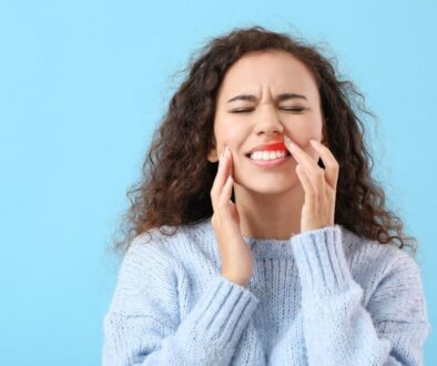 The woman is experiencing periodontal disease.