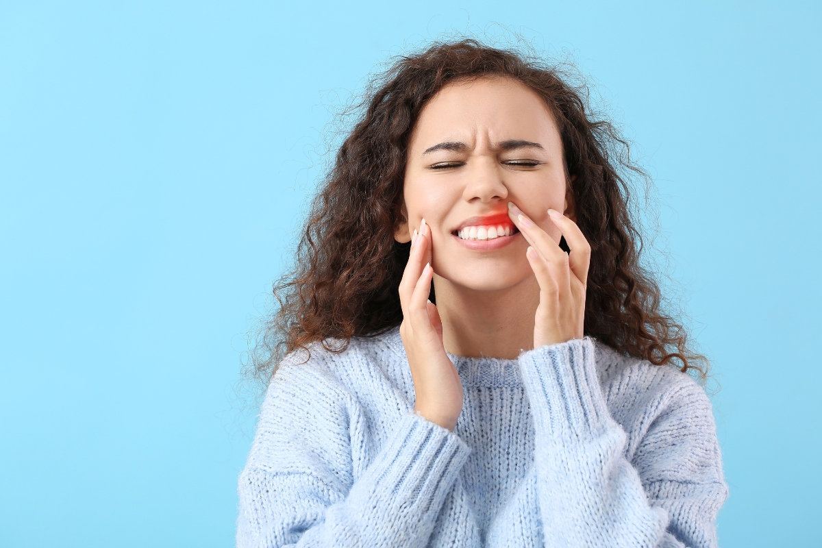 The woman is experiencing periodontal disease.