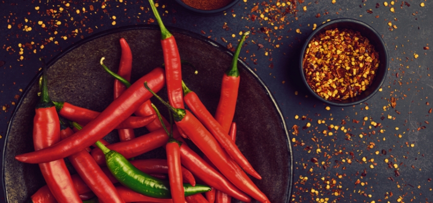 Spicy red chili peppers and seasonings known as foods that clear sinus congestion.