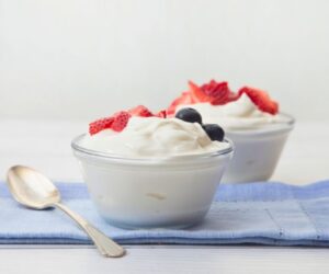 Fresh yogurt with berries, a simple option when asking is yogurt good for constipation.