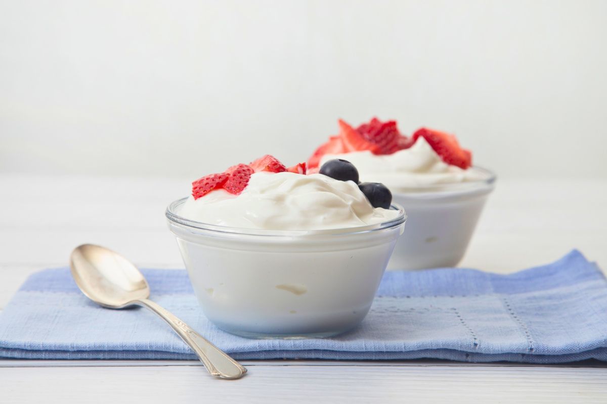 Fresh yogurt with berries, a simple option when asking is yogurt good for constipation.